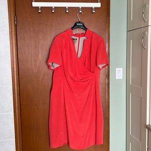 Almost new (worn once - dry cleaned) beautiful silk dress. Color orange salmon.